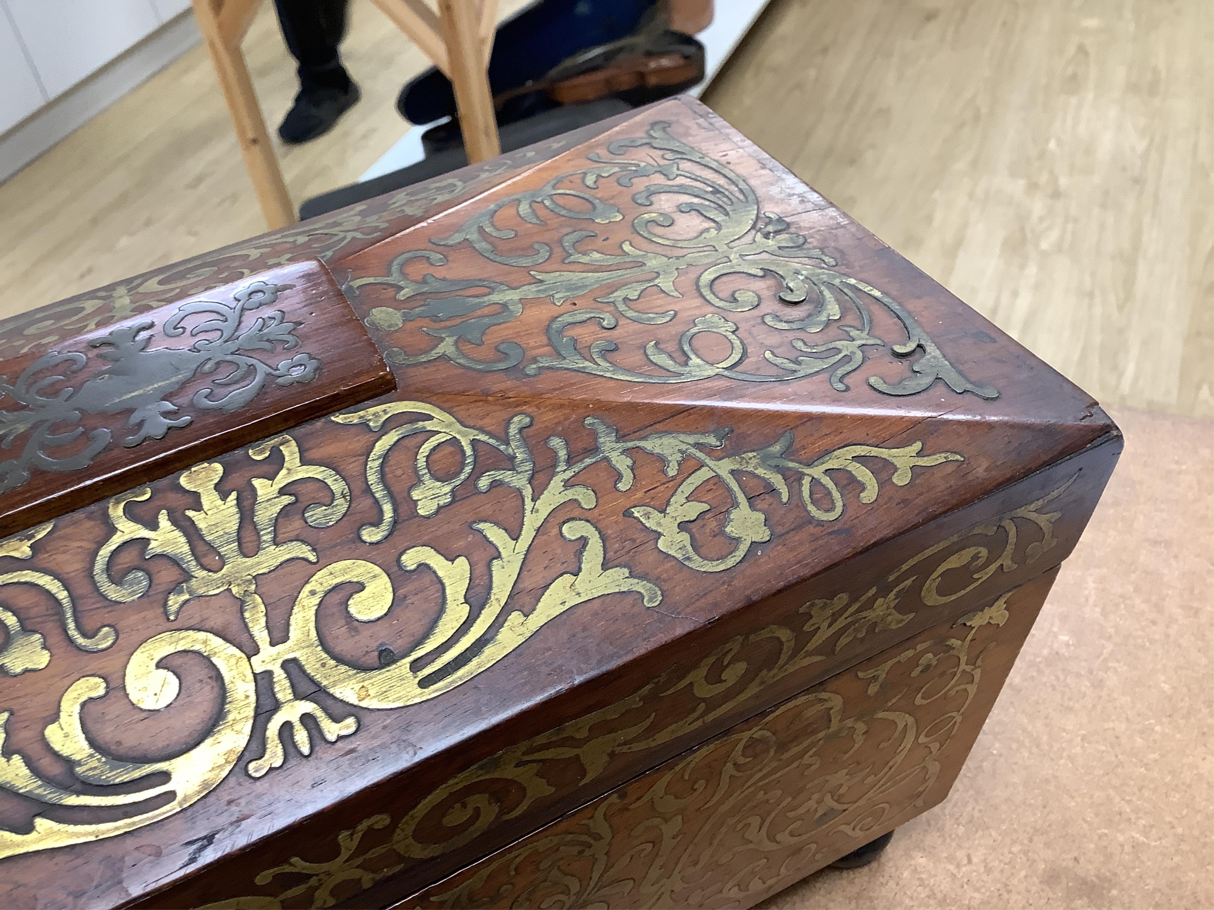 A William IV rosewood and cut brass inlaid tea caddy, 32cm wide